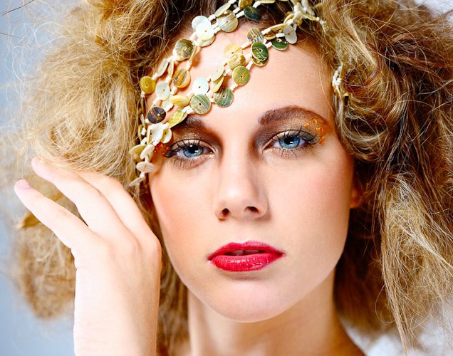 Editorial fashion shot lit with strong directional studio light