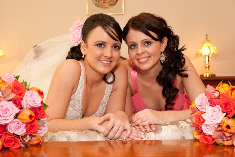 Bridal portrait by Studio 79 — full white gown, cathedral veil, studio backdrop